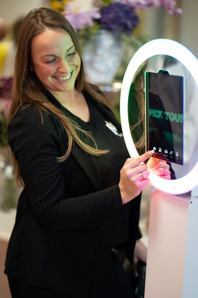 Guest using the Selfie Station Digital Drop-Off photo booth with instant photo, GIF, Boomerang, and video sharing at a corporate event.