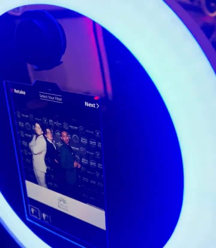 Selfie Station Luxe premium DSLR photo booth setup with professional lighting at a Magic Mirror of New England event